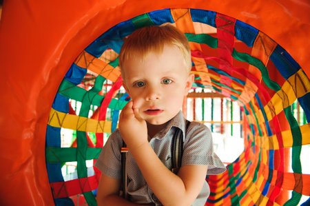 A modern children playground indoor. Boy have fun.の写真素材