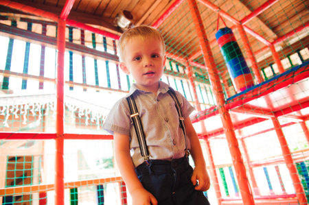 Boy playing on the playground, in the childrens maze.の写真素材