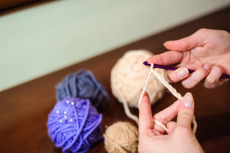 Close up of hands knitting. Process of knittingの写真素材