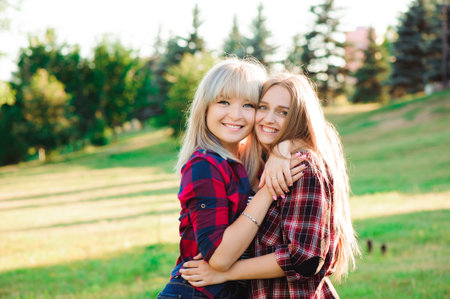 Girl hugging her best friend in the park