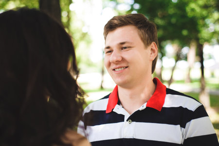 Lovely happy couple at a summer park.の写真素材