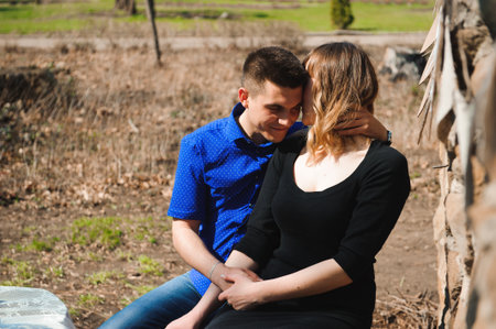 Portrait of young couple in love in a parkの写真素材