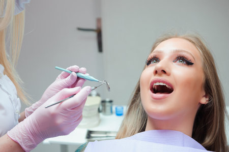 Young woman having medical checkup in the dentist officeの写真素材