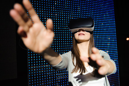 Double exposure of happy woman using VR-headset glasses