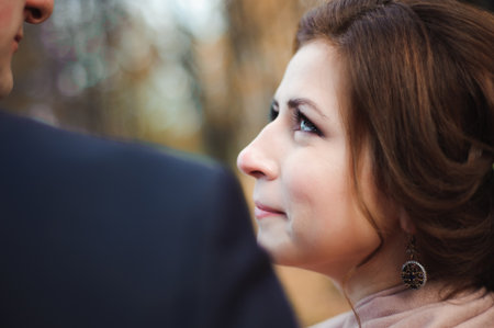 Couple walks in the park. Romantic embrace of newlyweds.の写真素材
