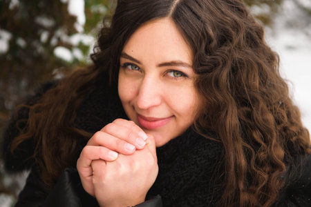Happy young woman walking in winter time