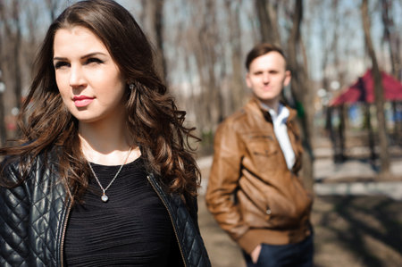 Portrait of young couple in love in a parkの写真素材