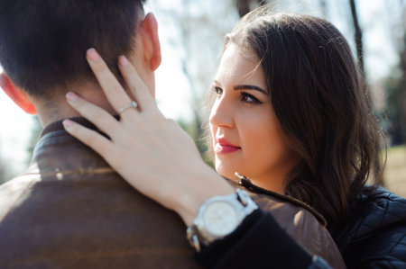 Portrait of young couple in love in a parkの写真素材