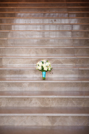 Wedding bouquet of roses on a granite tableの写真素材