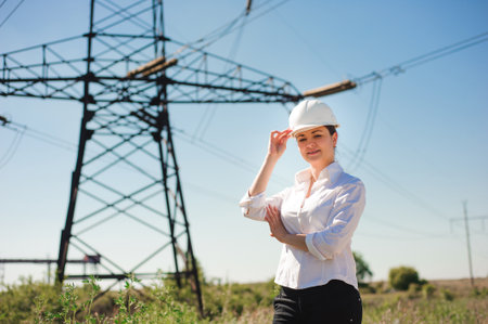 beautiful woman engineer work at an electrical substation.の写真素材