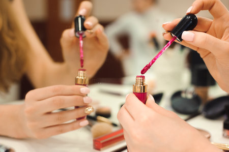Makeup products and brushes. Set of decorative cosmetics in hands of stylist.の写真素材