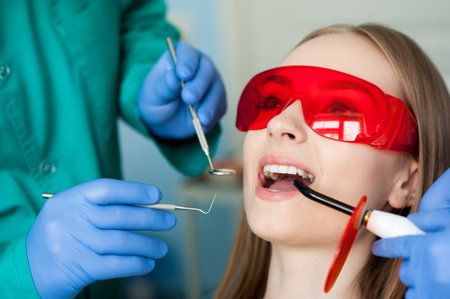 Dentist examining a patients teeth. Dental clinic.の写真素材