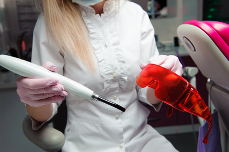 Close-up of dentists hands and dental equipment. dentist inspection.の写真素材