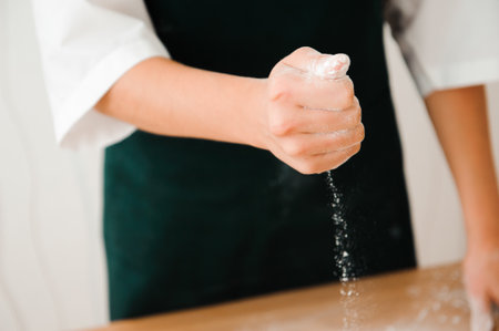 Chef preparing dough - cooking process, work with flourの写真素材