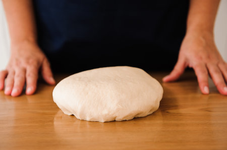 Chef preparing dough - cooking process, work with flourの写真素材