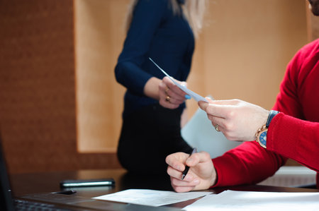 businessman with her staff, people group in background at modern bright office indoorsの写真素材