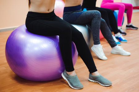 Beautiful caucasian women doing exercise with gymnastic ballの写真素材