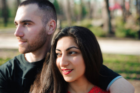 Man and woman in love posing in the park