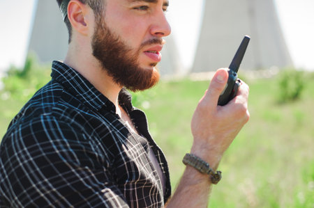 Portrait of a beautiful engineer at work with the phone.の写真素材