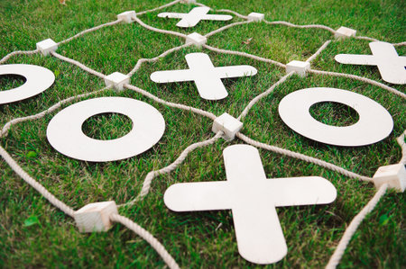 Tic tac toe game. Game on green grassの写真素材