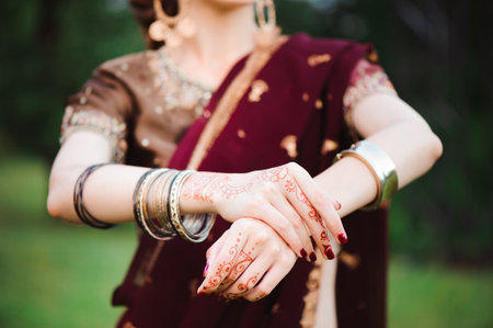 Mehndi tattoo. Woman Hands with black henna tattoos. India national traditions.の写真素材