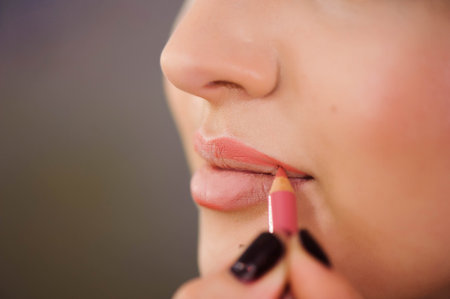 Applying lips contour. Closeup Of Woman Face. Beauty Cosmetics, Makeup Concept.の素材 [FY310122572867]