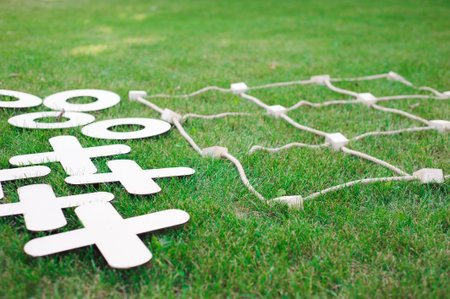 Tic tac toe game. Game on green grassの写真素材