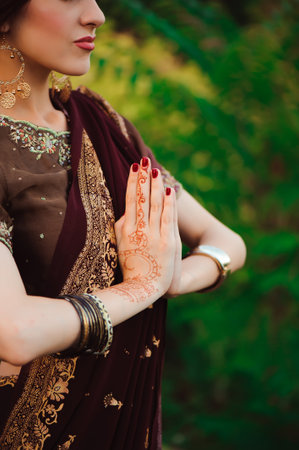 henna wedding design, Woman Hands with black mehndi tattoo. Hands of Indian bride girl with black...