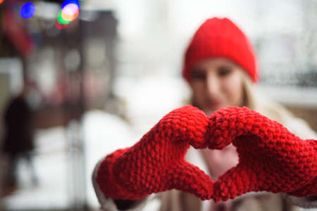Young beautiful girl outdoors in the winter city.の写真素材