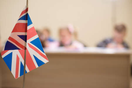 The UK flag is on the desk of the teacher classroom at the school.の写真素材