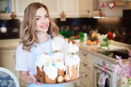 Happy easter. A mother with cakes prepares for Easter.