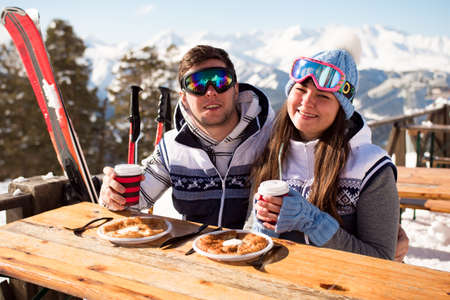 Winter, ski - skiers enjoying lunch in winter mountains.の写真素材