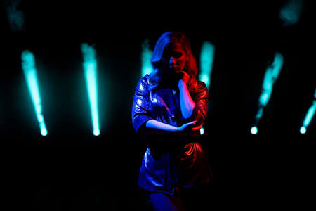 Singer standing on the stage in the night club.の写真素材