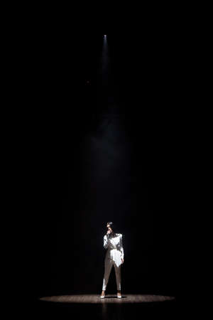 Artist performing live on scene in music hall