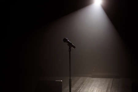 microphone on the stage with black backgroundの写真素材