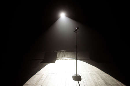 microphone on the stage with black backgroundの写真素材