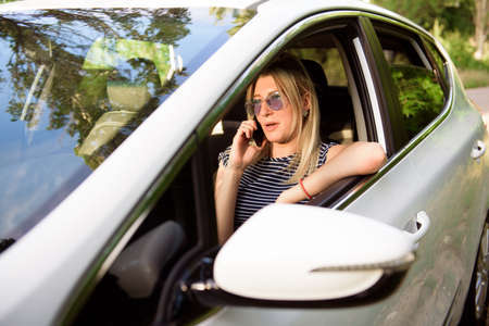 Women driving a car during the drive to travel journey.の写真素材