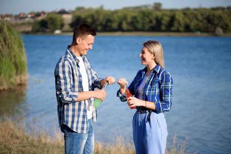 Young couple in love enjoying cocktail at the beachの写真素材