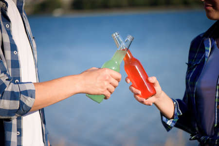 Young couple in love enjoying cocktail at the beach