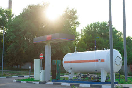 Equipment at a gas station on a summer day.