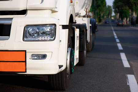 A large gas tank goes down the highway.の写真素材