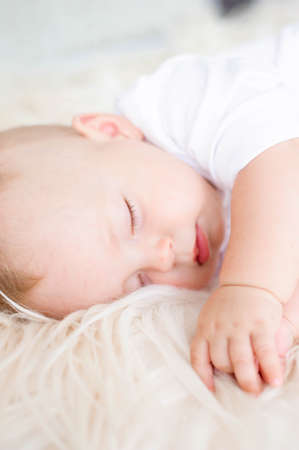 Young mother, holding tenderly her newborn baby boyの写真素材