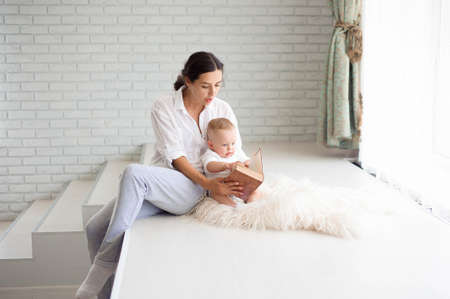 Mother and Baby playing and hugging. Happy Familyの写真素材