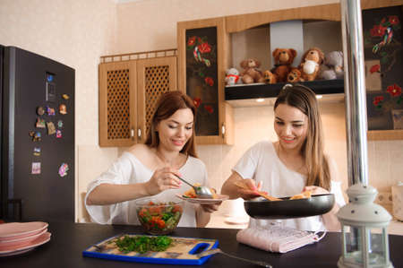 Girl Friends Prepare A meal, Mealtime Togetherの写真素材