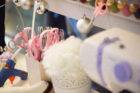 sewing machine and fabric isolated on white table.の写真素材