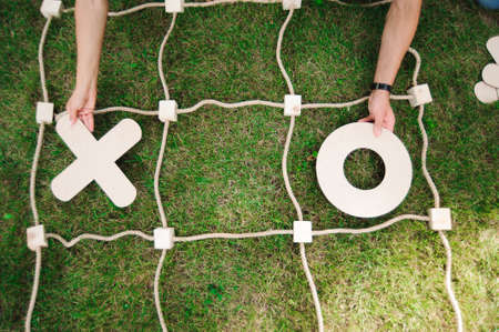 Tic tac toe game on the green grass.の写真素材