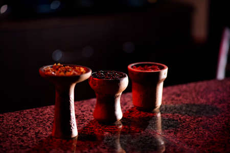 Clay bowl for hookah with tobacco and accessories for making hookah.の写真素材