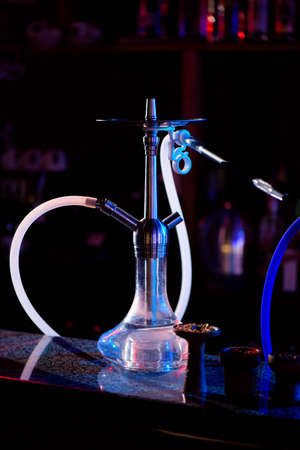 Group of eastern hookahs on table of a bar.の写真素材