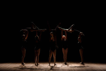 Acrobatic dance. Dance with elements of acrobatics. Girls doing dance supportの写真素材