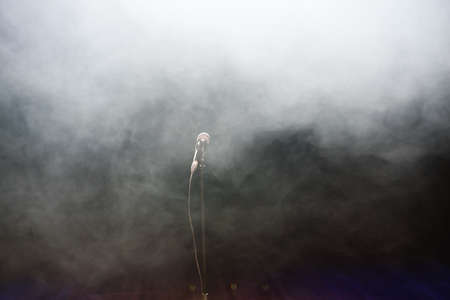 Live music background. Microphone and stage lights. Sing and karaoke.の写真素材